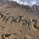 sindsro skrevet i sand